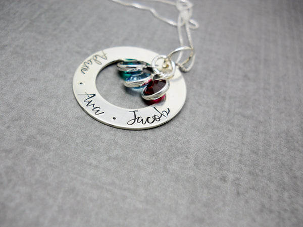 Sterling silver personalized Mothers washer necklace with kids names, flat lay
