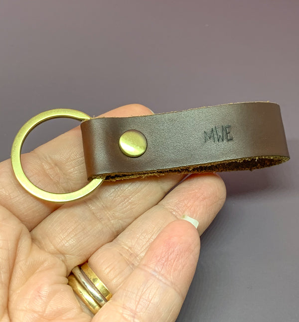 personalized leather key chain in hand