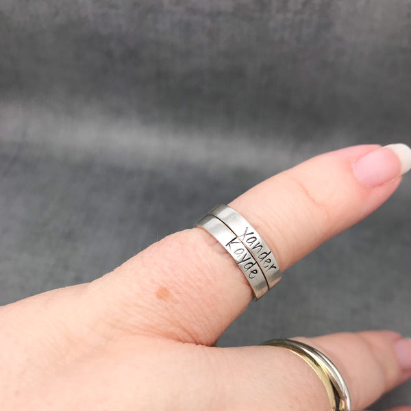 Sterling Silver Personalized Stackable Name Ring, modeled on finger